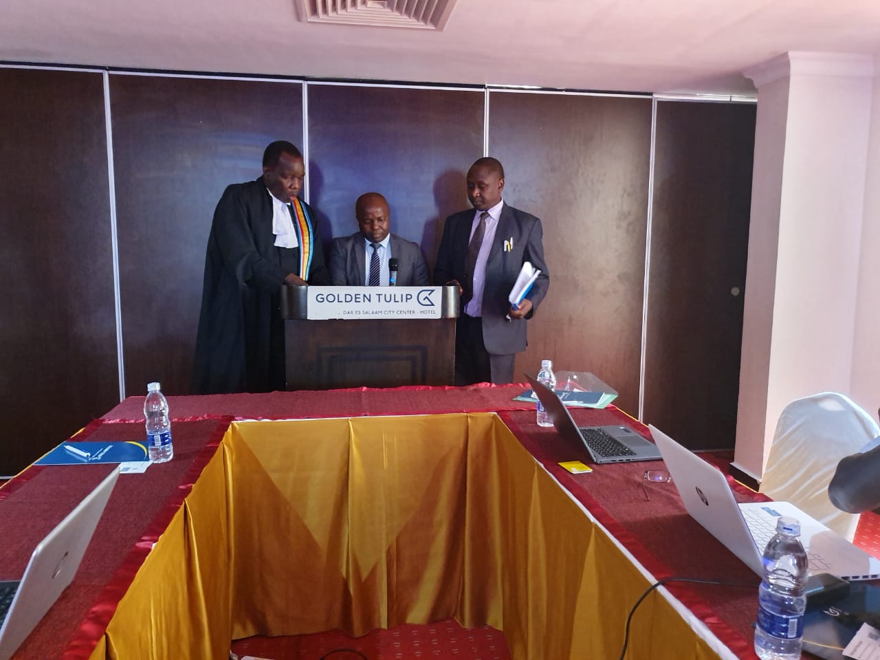 The Counsel to the Community, Dr. Anthony Kafumbe (on the right), the Registrar of the East African Court of Justice, Mr. Yufnalis N. Okubo (on the left) and Dr. John K. Mduma (centre) at the swearing in ceremony. 
