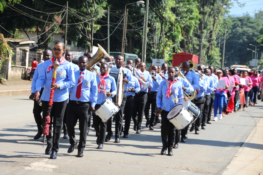 The Tanzania Peoples' Defence Forces Monduli Military Academy Band leads the procession through the streets of Arusha during celebrations by the EAC to mark the International Women's Day 2020. 