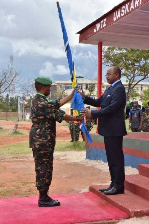 Tanzania’s Minister of Defence and National Service, Hon. Dr. Hussein Ali Mwinyi handing over the EAC Flag to the Command Post Exercise Director symbolizing the official launch of the Exercise 