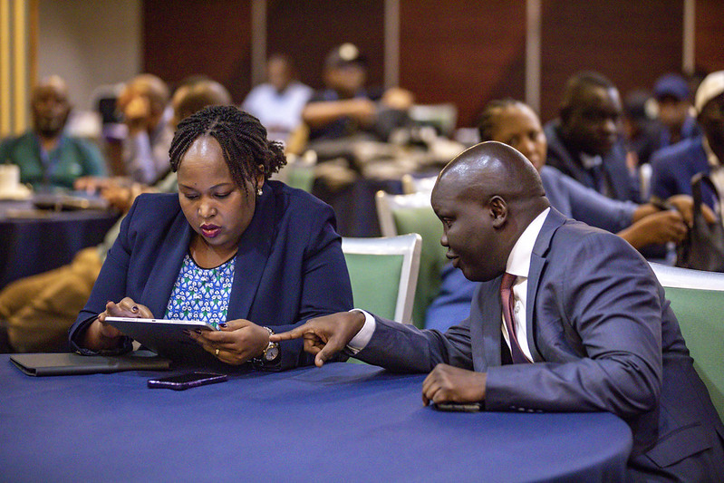 The EAC Secretary General, H.E. Veronica Nduva, confers with the Deputy Secretary General in charge of Infrastructure, Productive, Social and Political Sectors, Hon. Andrea Aguer Ariik Malueth, during the launch of the EAC Election Observation Mission to Rwanda.