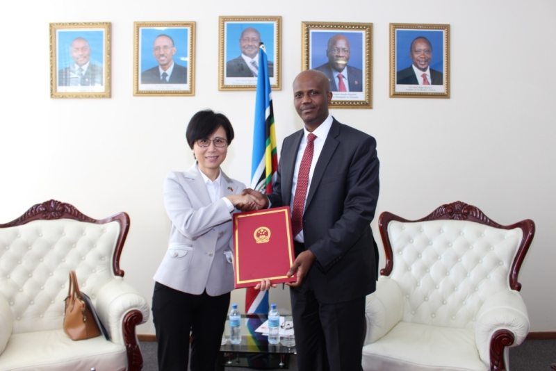 Ambassador Wang Ke from the People’s Republic of China and EAC Secretary General, Amb Liberat Mfumukeko pose for a photo after signing a Financial Agreement
