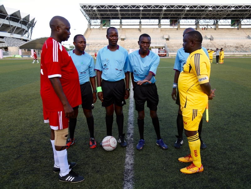 EALA Captain, Kenneth Madete (left) and the Captain of the Bunge Sports Club, Tanzania, Hon Gibson Ole Meseyiek look on as the referee tosses a coin at the start of the match.  Parliament of Kenya beat Parliament of Tanzania 6-0 in an entertaining match