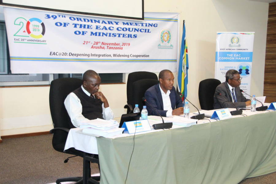 The Chairperson of the Senior Officials Session of the 39th Council of Ministers, Mr. Emmanuel Mugisha (Rwanda, centre), with the Rapporteur, Mr. Raphael Kanothi (Kenya, left), and Dr. Kamugisha Kazaura, Director of Infrastructure at the EAC Secretariat.