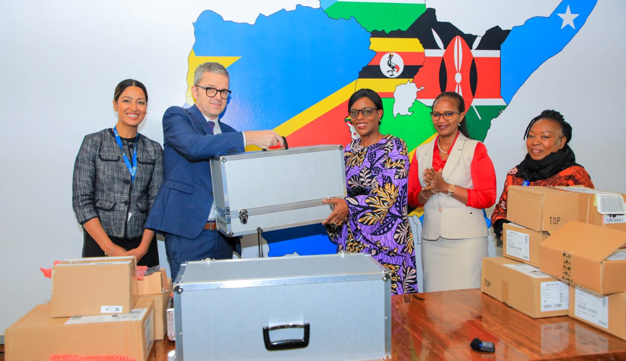  EAC Deputy Secretary General in charge Customs,Trade and Monetary Affairs, Ms. Annette Ssemuwemba receives the equipment from Head of Cooperation and Cultural Affairs, Mr. Luc Blanco on behalf of French Ambassador. Together with the DSG is the EAC Director of Customs, Ms. Flavia Busingye (Second right), Director of Human Resource, Ruth Simba (third right) and Ms. Nadia Guillo, advisor on French language in the Community ( second left)
