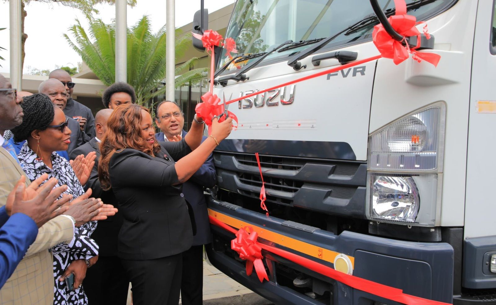 EAC Secretary General, H.E Veronica Nduv cuts the ribbon of the Isuzu FVR Tipper Truck, signifying progress in the trade expansion of locally assembled vehicles within the EAC. 